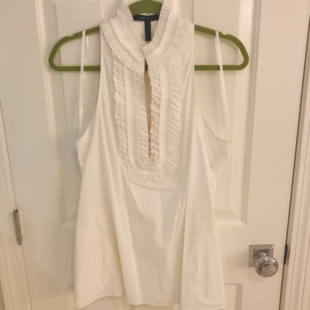 BCBG white sleeveless ruffle top with pockets
